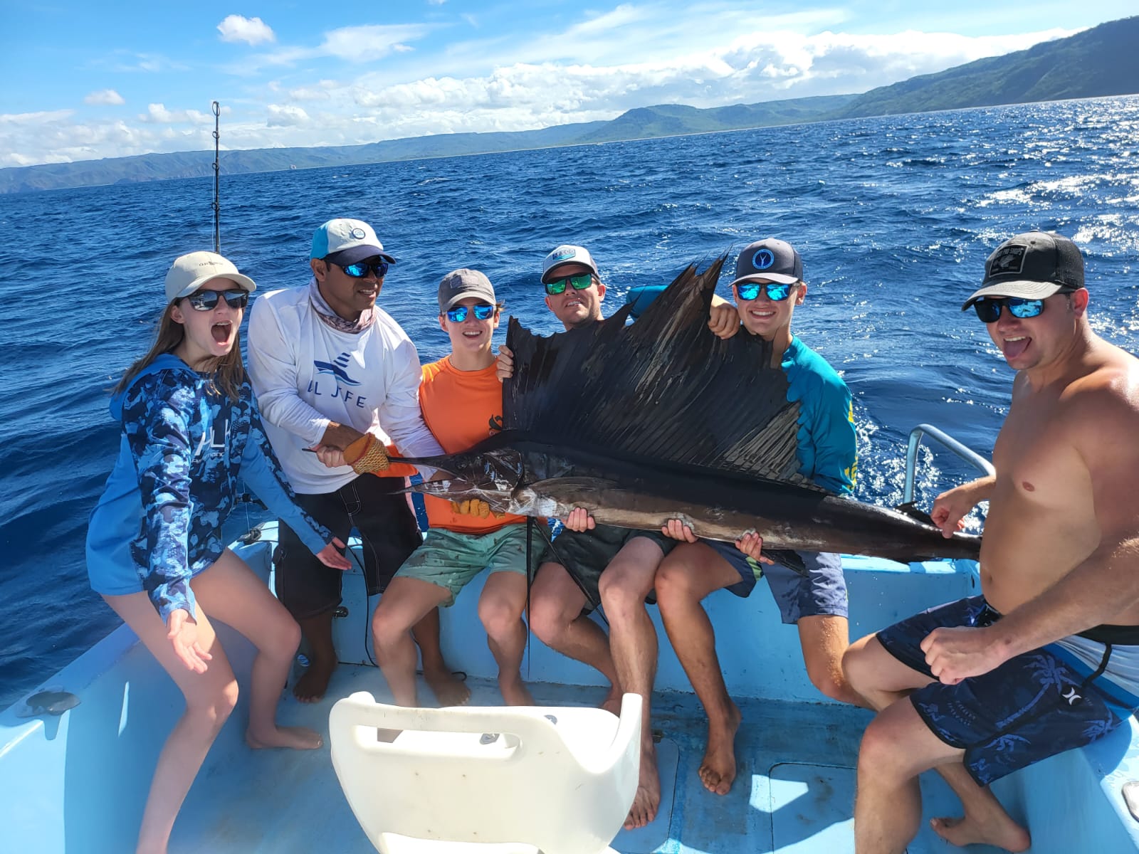 happy family with a marlin in costa rica