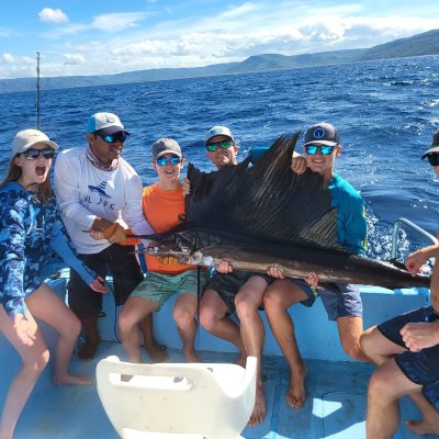 happy family with a marlin in costa rica